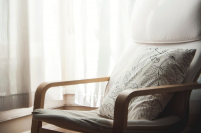 white pillow with leaves print